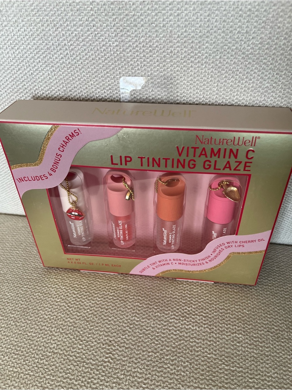 NWT NatureWell Vitamin C Lip Tinting Glaze set with bonus charms. 💄👄